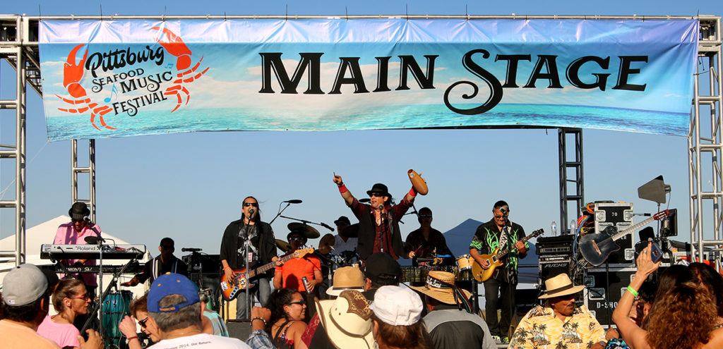 Image of crowd and musical performance at the Pittsburg Seafood Festival