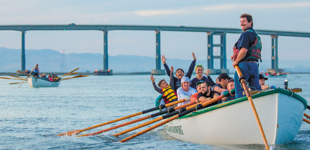 Image of boaters enjoying summertime rowing on the bay.